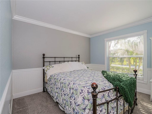 carpeted bedroom with ornamental molding