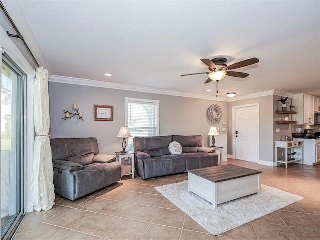 living room featuring ceiling fan, light tile patterned floors, and crown molding