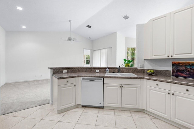 kitchen with dishwasher, sink, light colored carpet, white cabinetry, and lofted ceiling