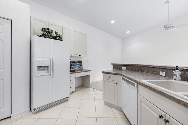 kitchen featuring white appliances, white cabinetry, sink, ceiling fan, and light tile patterned flooring