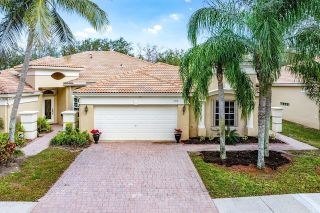 mediterranean / spanish-style house featuring a garage