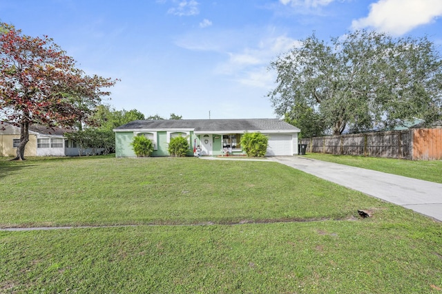 ranch-style house with a garage and a front lawn