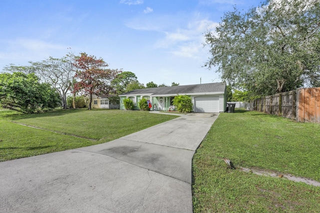 single story home featuring a front yard and a garage