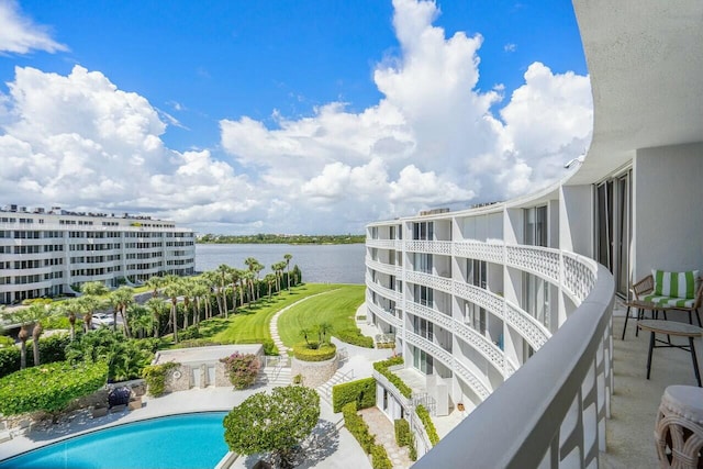 view of pool with a water view