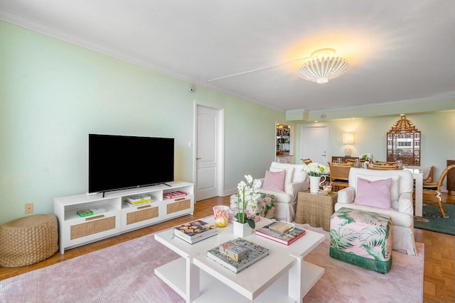 living room with light parquet floors and crown molding