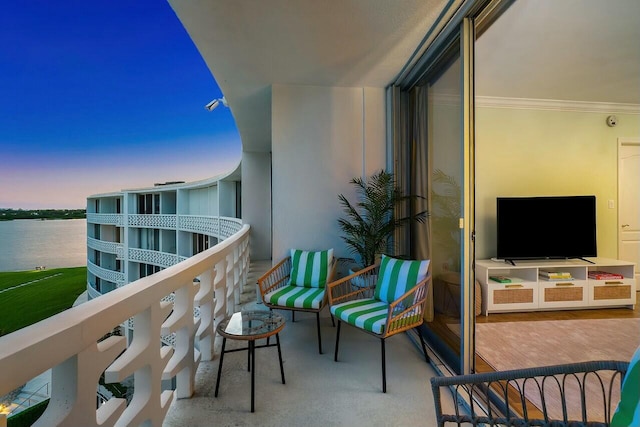 balcony at dusk with a water view