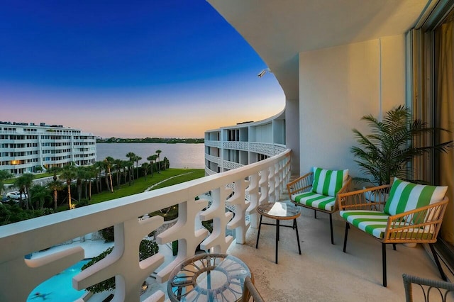 balcony at dusk with a water view