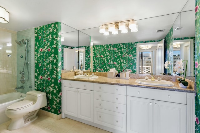 full bathroom with toilet, tiled shower / bath combo, tile patterned floors, and vanity