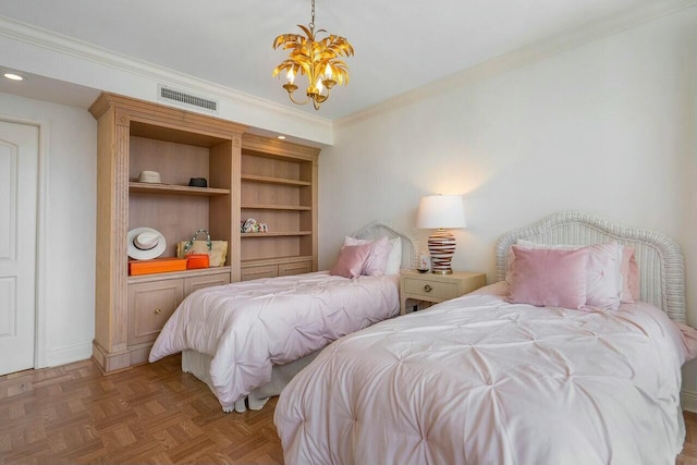 bedroom with a notable chandelier, crown molding, and parquet flooring