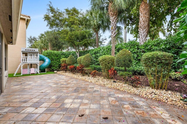 view of patio featuring a playground