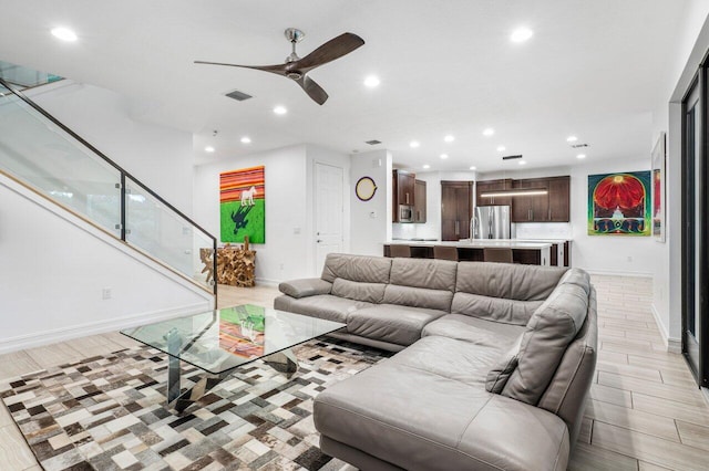 living room with ceiling fan