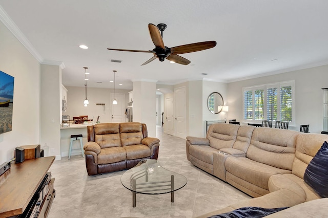 living room featuring ceiling fan and ornamental molding