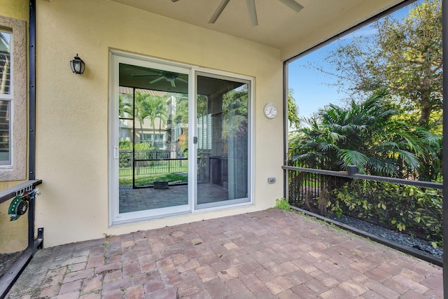 exterior space featuring ceiling fan and a patio area