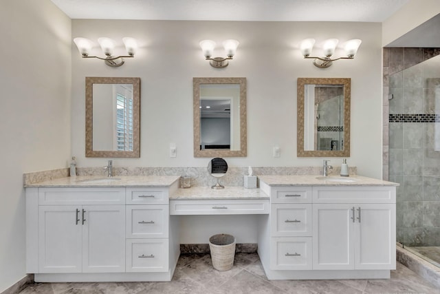 bathroom featuring vanity and a tile shower