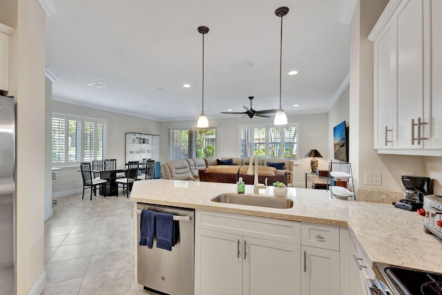 kitchen with stainless steel appliances, white cabinetry, sink, and crown molding