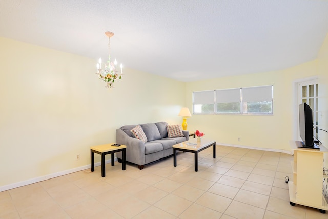 tiled living room with a chandelier