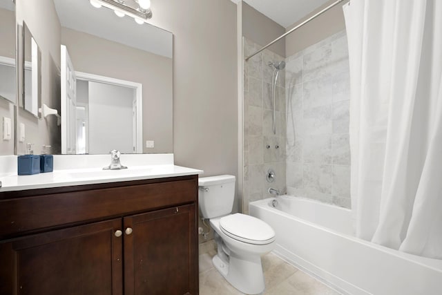 bathroom with tile patterned floors, toilet, shower / bath combo with shower curtain, and vanity