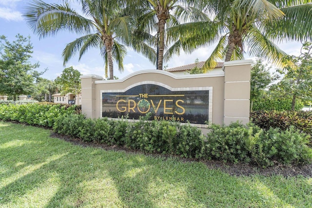 community / neighborhood sign with a lawn