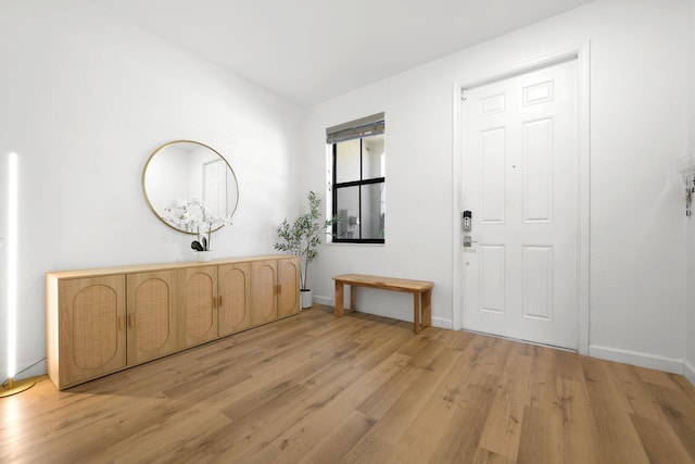 entrance foyer featuring light wood-style floors and baseboards