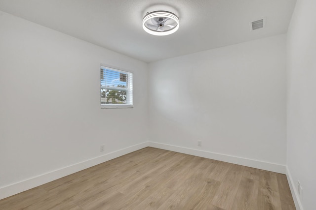 empty room with light hardwood / wood-style flooring