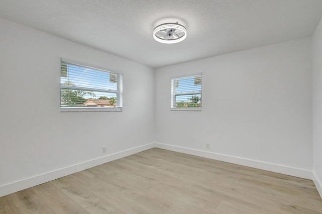 spare room featuring light hardwood / wood-style flooring