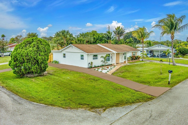 single story home with a front yard