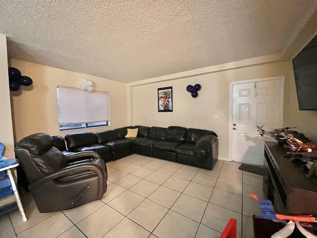 living room featuring a textured ceiling and light tile patterned floors