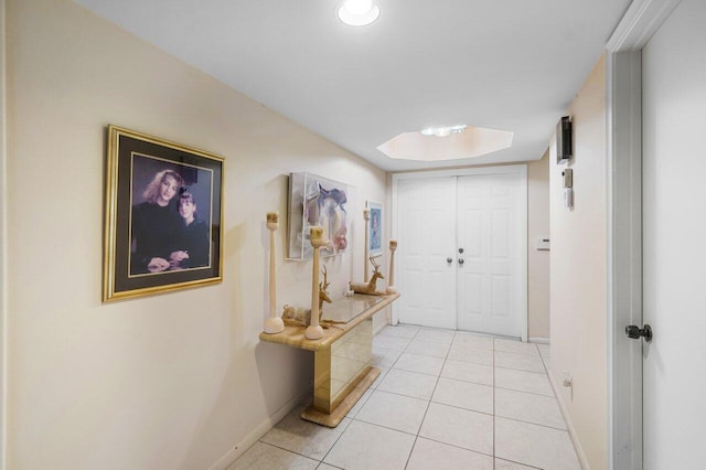 hallway featuring light tile patterned flooring