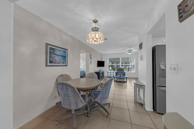 dining area with ceiling fan and light tile patterned floors