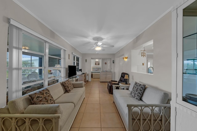 living room featuring light tile patterned flooring, ceiling fan, and ornamental molding