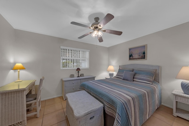 tiled bedroom featuring ceiling fan