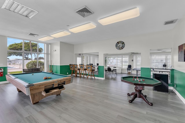 game room with pool table and light hardwood / wood-style floors