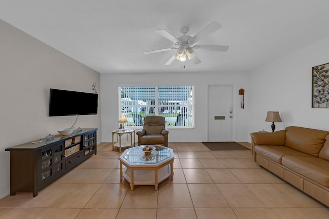 tiled living room with ceiling fan