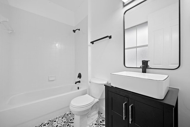 full bathroom with tiled shower / bath combo, toilet, and vanity