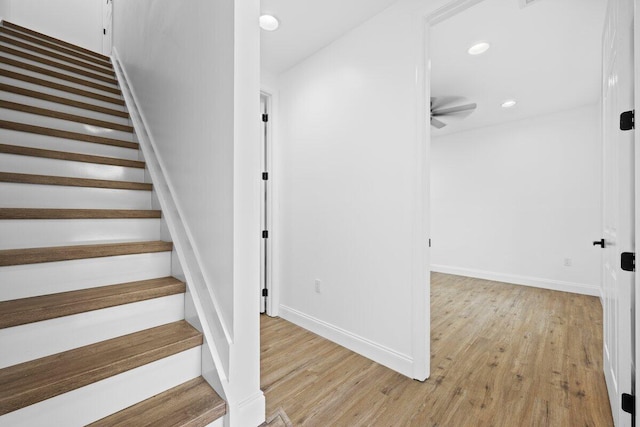 stairway with wood-type flooring