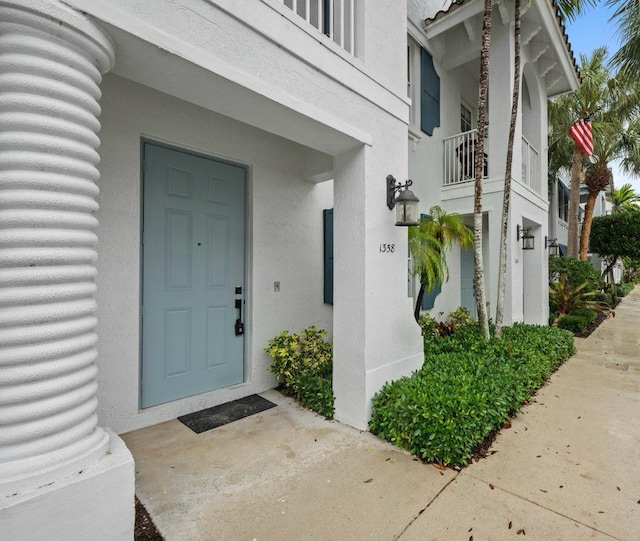 entrance to property with a balcony