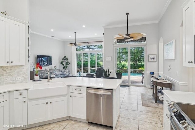 kitchen featuring white cabinetry, ceiling fan, stainless steel appliances, and kitchen peninsula