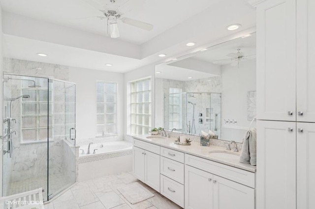 bathroom featuring vanity, shower with separate bathtub, and ceiling fan