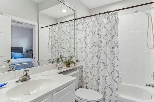 full bathroom with vanity, toilet, and shower / bath combo with shower curtain