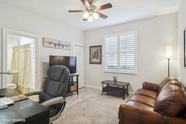 home office with light colored carpet and ceiling fan