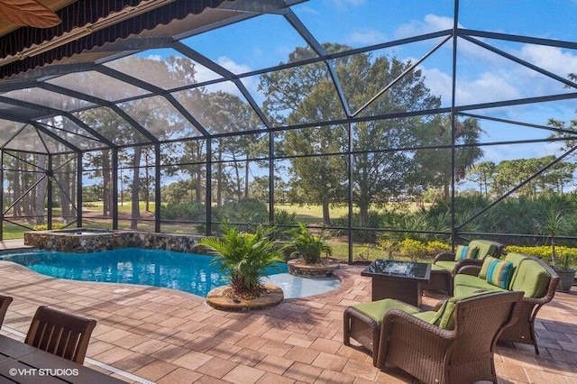 view of swimming pool with a lanai, outdoor lounge area, and a patio