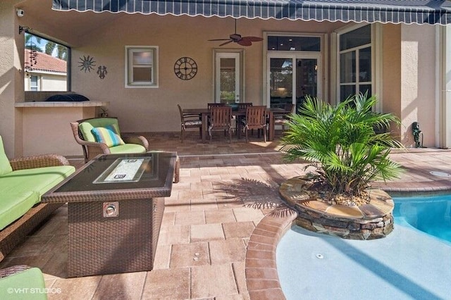 view of patio with ceiling fan