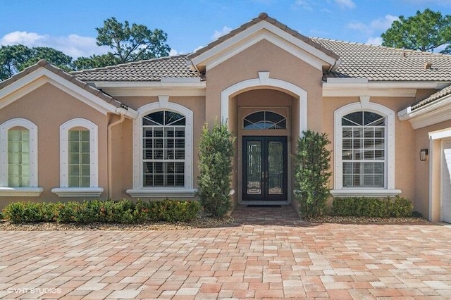 doorway to property featuring french doors