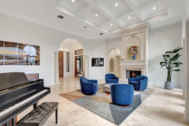 living room with crown molding, a high ceiling, coffered ceiling, a fireplace, and beamed ceiling