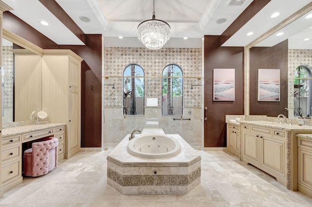 bathroom featuring tiled bath, vanity, a raised ceiling, crown molding, and an inviting chandelier