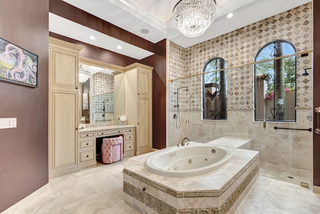 bathroom with vanity, a notable chandelier, and independent shower and bath