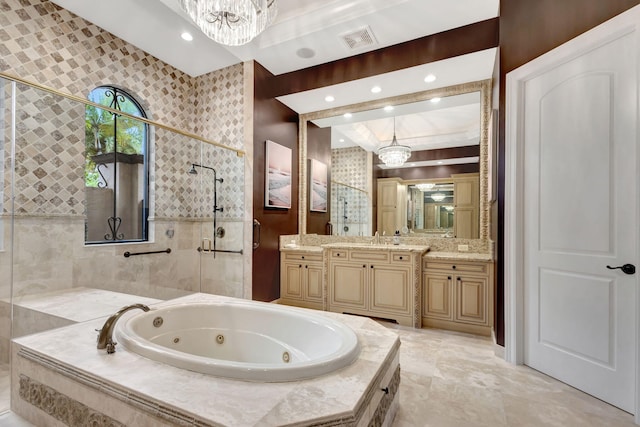 bathroom with vanity, separate shower and tub, and a notable chandelier