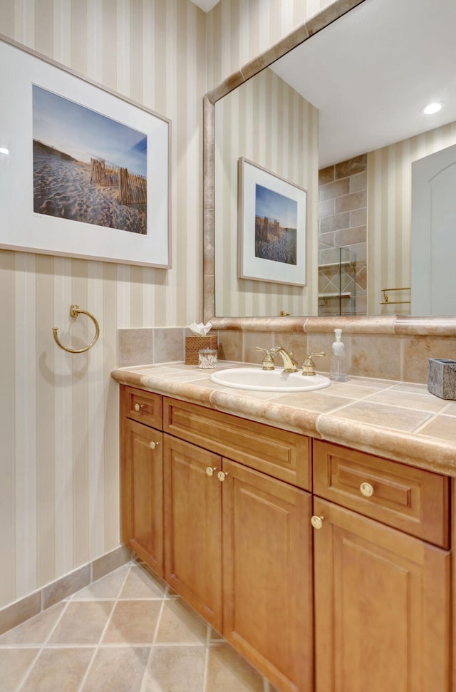 bathroom featuring tile patterned flooring and vanity