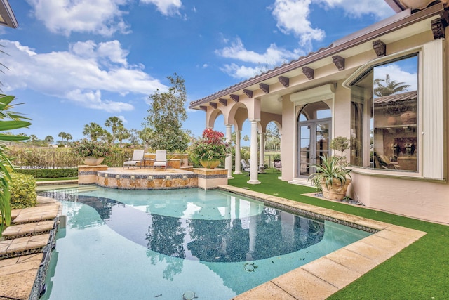 view of pool featuring a yard