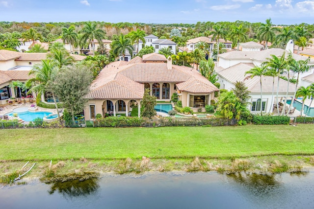 birds eye view of property with a water view